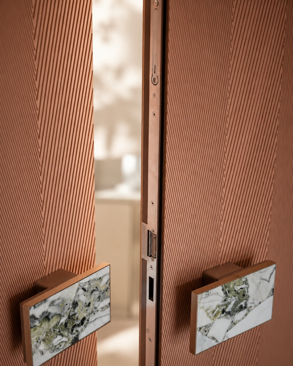 Terracotta fluted double doors with marble handles